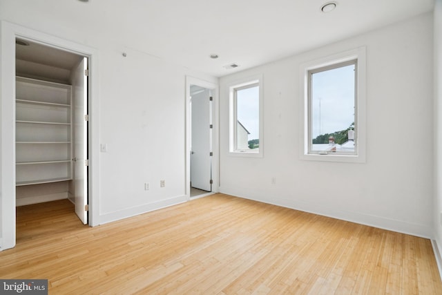 315 Dupont St, Philadelphia, PA 19128 - unfurnished bedroom with a spacious closet, light wood-style flooring, and a closet
