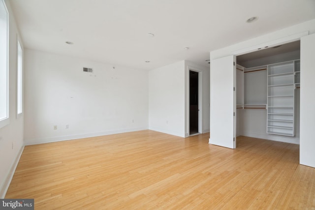 315 Dupont St, Philadelphia, PA 19128 - unfurnished bedroom featuring wood finished floors, a walk in closet, and a closet