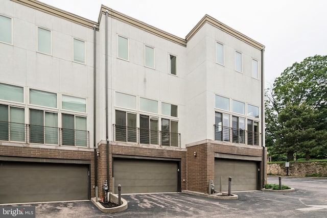 315 Dupont St, Philadelphia, PA 19128 - view of building exterior featuring a garage and driveway