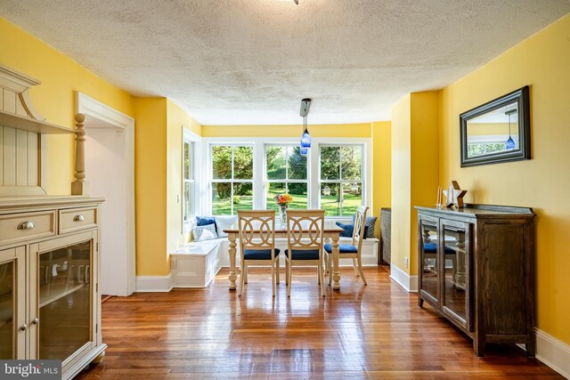 1148 Bodine Rd, Chester Springs, PA 19425 - dining area featuring a textured ceiling, dark wood-style flooring, baseboards, and breakfast area