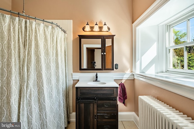 1148 Bodine Rd, Chester Springs, PA 19425 - bathroom featuring radiator heating unit, vanity, tile patterned floors, and a shower with shower curtain