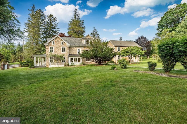 1148 Bodine Rd, Chester Springs, PA 19425 - rear view of property featuring stone siding and a yard