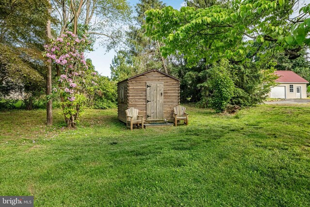 1148 Bodine Rd, Chester Springs, PA 19425 - view of green lawn featuring a detached garage