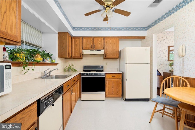 8 Pamlico Ct, Bordentown, NJ 08505 - kitchen featuring white appliances, under cabinet range hood, a sink, wallpapered walls, and brown cabinetry