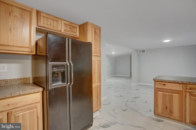 7 Cross Trl, Fairfield, PA 17320 - kitchen with black fridge with ice dispenser, light marble finish floors, light brown cabinetry, and baseboards