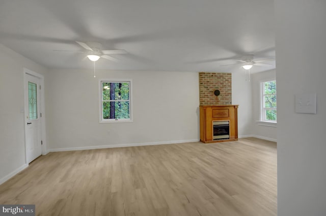 7 Cross Trl, Fairfield, PA 17320 - unfurnished living room featuring ceiling fan, light wood-type flooring, a fireplace, and baseboards