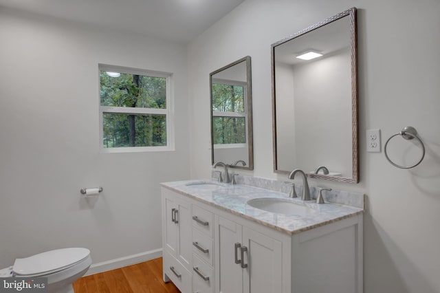 7 Cross Trl, Fairfield, PA 17320 - bathroom with wood finished floors, double vanity, toilet, and baseboards