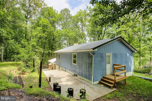 7 Cross Trl, Fairfield, PA 17320 - view of property exterior with metal roof, a patio area, a chimney, and a lawn