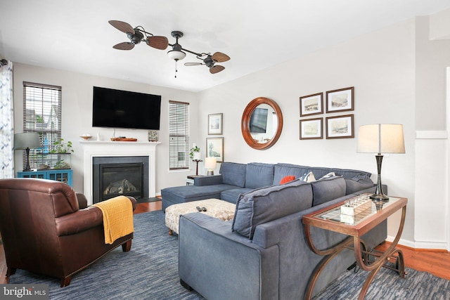 1 Crovo Ln, Fredericksburg, VA 22405 - living room featuring wood finished floors, a ceiling fan, a fireplace with flush hearth, and baseboards