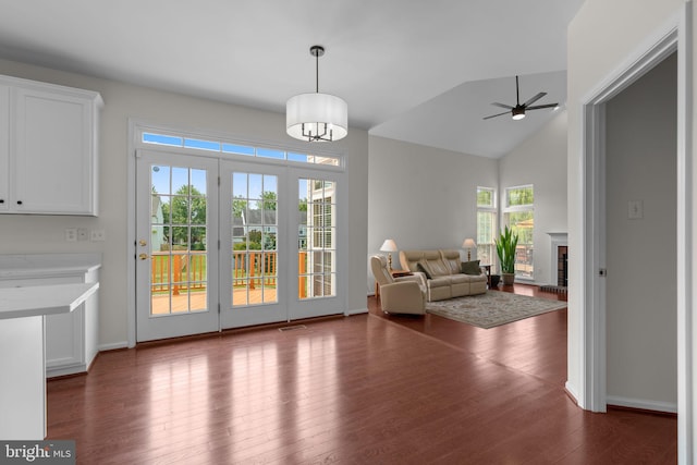 11221 Chaucers Ridge Ct, Laurel, MD 20723 - living area with dark wood-style flooring, ceiling fan, a fireplace, lofted ceiling, and baseboards
