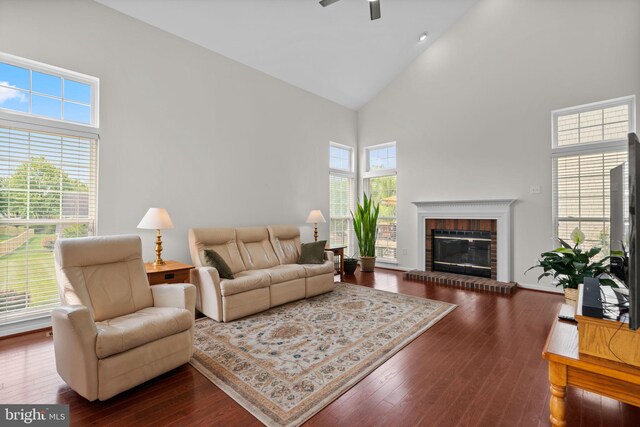 11221 Chaucers Ridge Ct, Laurel, MD 20723 - living area featuring high vaulted ceiling, a ceiling fan, dark wood-style flooring, and a fireplace