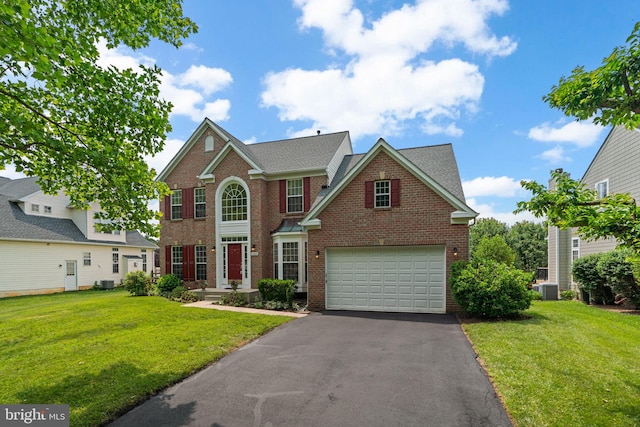 11221 Chaucers Ridge Ct, Laurel, MD 20723 - view of front of home with brick siding, asphalt driveway, a front yard, and cooling unit