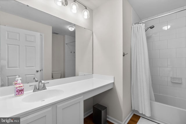 11221 Chaucers Ridge Ct, Laurel, MD 20723 - bathroom featuring vanity, shower / bathtub combination with curtain, wood finished floors, and toilet