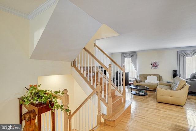 5941 Powells Landing Rd, Burke, VA 22015 - staircase with wood finished floors and crown molding