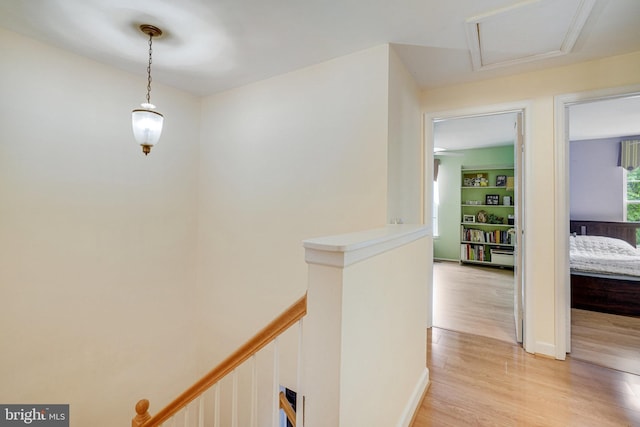 5941 Powells Landing Rd, Burke, VA 22015 - corridor with light wood finished floors, an upstairs landing, and attic access