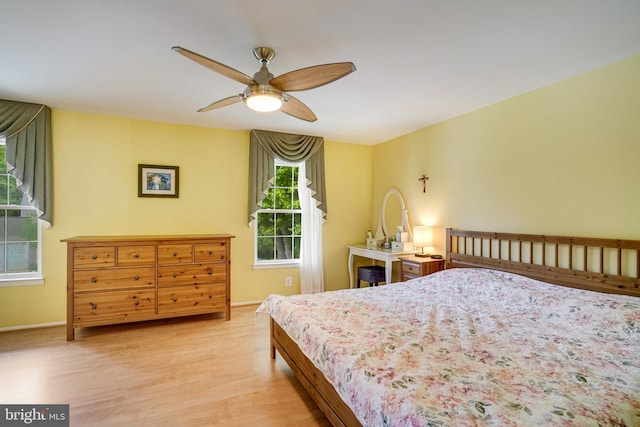 5941 Powells Landing Rd, Burke, VA 22015 - bedroom with light wood-style floors, baseboards, and ceiling fan