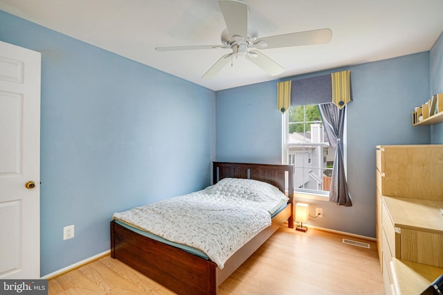 5941 Powells Landing Rd, Burke, VA 22015 - bedroom featuring wood finished floors, baseboards, and a ceiling fan