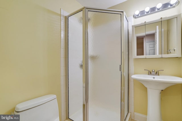 5941 Powells Landing Rd, Burke, VA 22015 - bathroom featuring a shower stall, toilet, and a sink