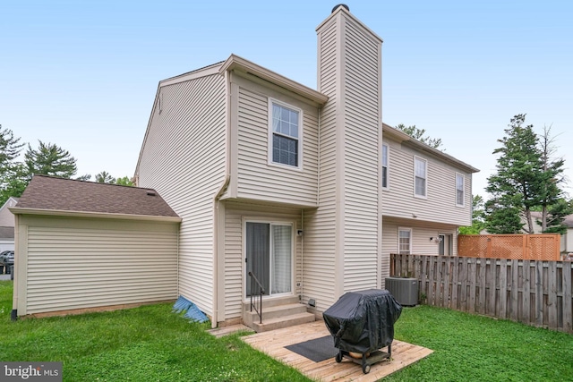 5941 Powells Landing Rd, Burke, VA 22015 - back of house with entry steps, central AC unit, and a chimney
