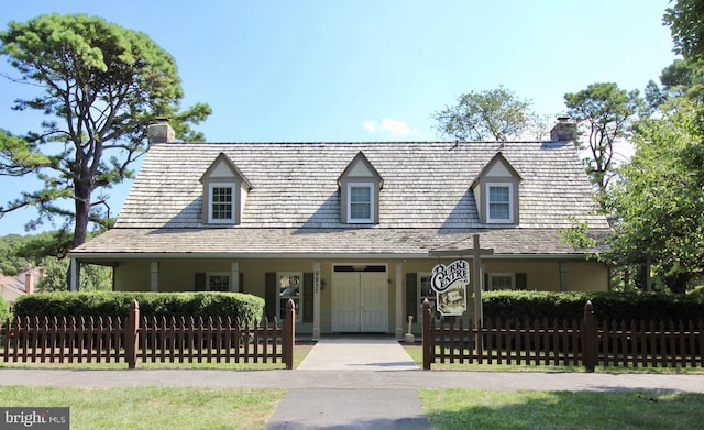 5941 Powells Landing Rd, Burke, VA 22015 - view of front facade featuring a chimney and covered porch