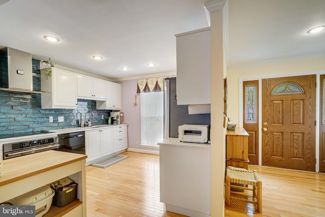 5941 Powells Landing Rd, Burke, VA 22015 - kitchen with wall chimney exhaust hood, black appliances, crown molding, white cabinetry, and light wood finished floors