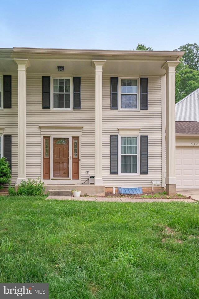 5941 Powells Landing Rd, Burke, VA 22015 - greek revival inspired property with a front lawn and a garage