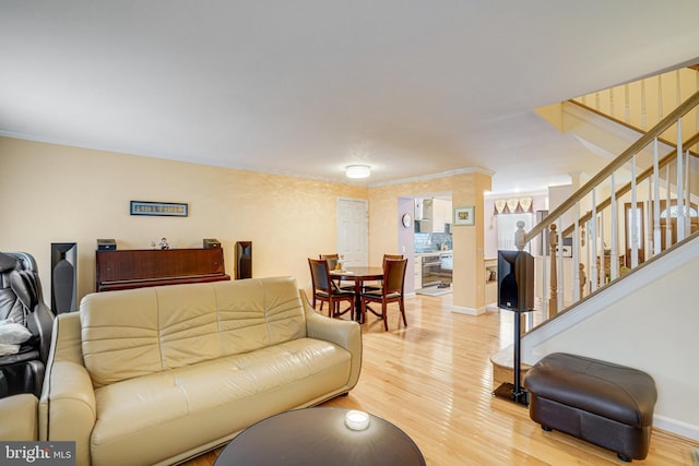 5941 Powells Landing Rd, Burke, VA 22015 - living room featuring light wood-style flooring, stairs, baseboards, and crown molding