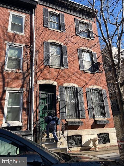 view of front of property with brick siding