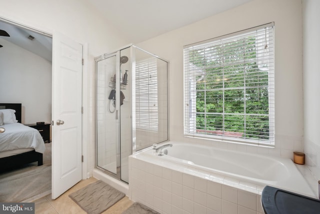 9435 Silver Meteor Ct, Manassas Park, VA 20111 - full bath featuring healthy amount of natural light, a stall shower, a bath, and tile patterned floors