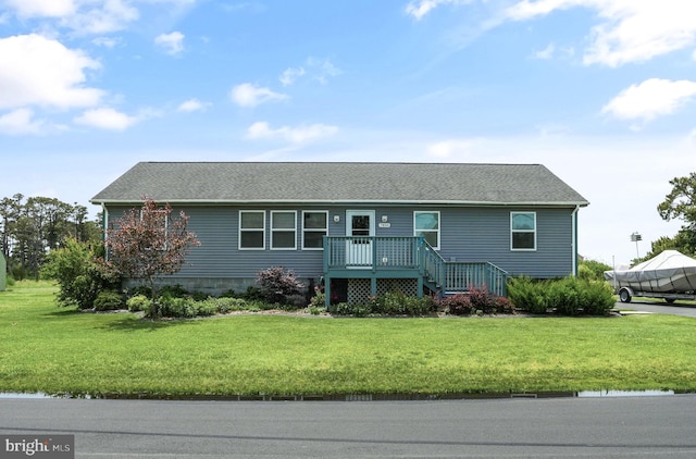7466 Beebe Rd, Chincoteague Island, VA 23336 - ranch-style house featuring a front lawn and roof with shingles