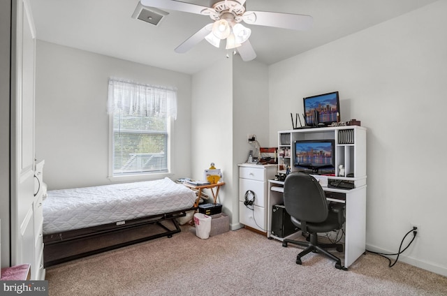 7466 Beebe Rd, Chincoteague Island, VA 23336 - bedroom with light carpet, a desk, a ceiling fan, and baseboards
