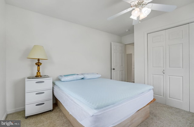 7466 Beebe Rd, Chincoteague Island, VA 23336 - bedroom with light carpet, a closet, and ceiling fan
