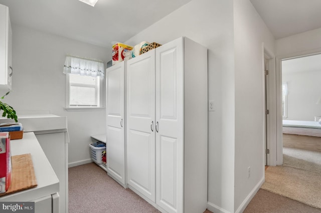 7466 Beebe Rd, Chincoteague Island, VA 23336 - corridor with light carpet and baseboards