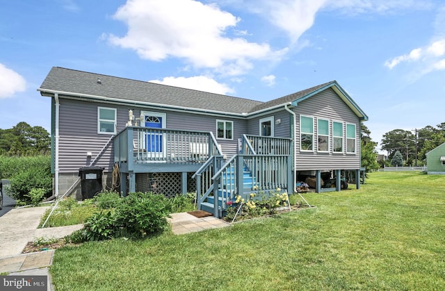 7466 Beebe Rd, Chincoteague Island, VA 23336 - back of property with a deck, a yard, a shingled roof, and stairs