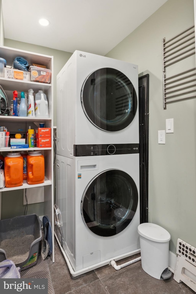 1208 Carrollsburg Pl SW, Washington, DC 20024 - laundry room with stacked washer / drying machine, radiator, and recessed lighting
