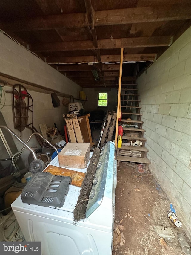 below grade area featuring concrete block wall