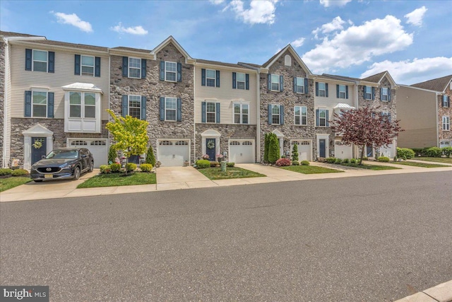 1027 Regency Pl, Sewell, NJ 08080 - multi unit property featuring driveway, an attached garage, a residential view, and stone siding