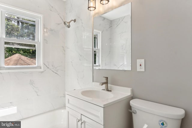 full bathroom featuring vanity, toilet, a shower, and a bathtub