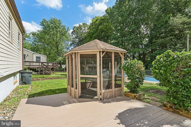 deck with a sunroom