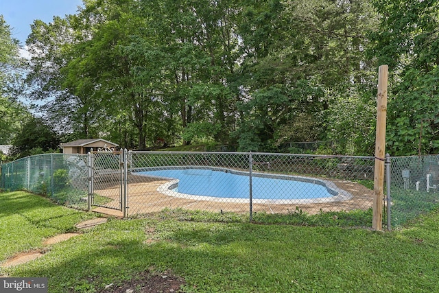 view of swimming pool with a gate