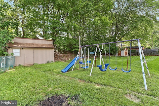 view of jungle gym featuring an outbuilding and a storage shed