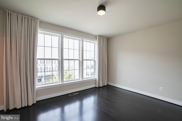 2519 Auden Dr, Silver Spring, MD 20906 - spare room with baseboards and dark wood-style floors