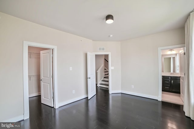 2519 Auden Dr, Silver Spring, MD 20906 - spare room featuring dark wood-type flooring and stairs