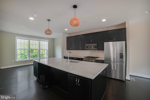 2519 Auden Dr, Silver Spring, MD 20906 - kitchen featuring appliances with stainless steel finishes, dark cabinets, light countertops, decorative backsplash, and recessed lighting