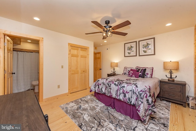 bedroom with wood finished floors, recessed lighting, connected bathroom, a closet, and ceiling fan