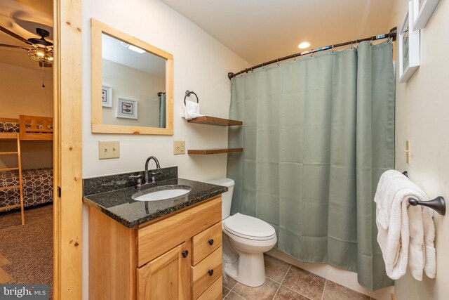 bathroom with ceiling fan, vanity, toilet, curtained shower, and recessed lighting