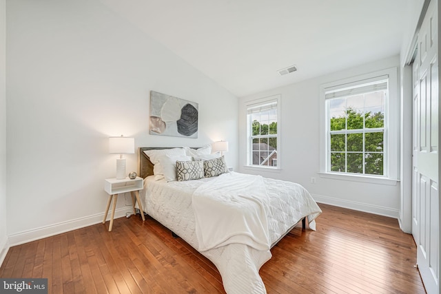 8217 Castanea Ln, Derwood, MD 20855 - bedroom with wood-type flooring, baseboards, and lofted ceiling