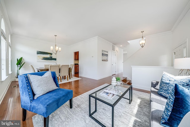 8217 Castanea Ln, Derwood, MD 20855 - living area featuring a chandelier, wood finished floors, crown molding, and baseboards