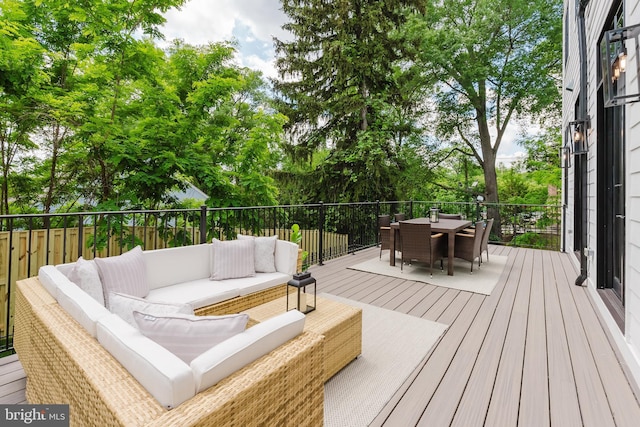 5024 Dana Pl NW, Washington, DC 20016 - wooden terrace featuring outdoor lounge area, outdoor dining area, and view of wooded area