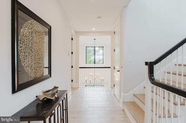 5024 Dana Pl NW, Washington, DC 20016 - hall featuring light wood-style flooring, stairs, recessed lighting, a chandelier, and baseboards